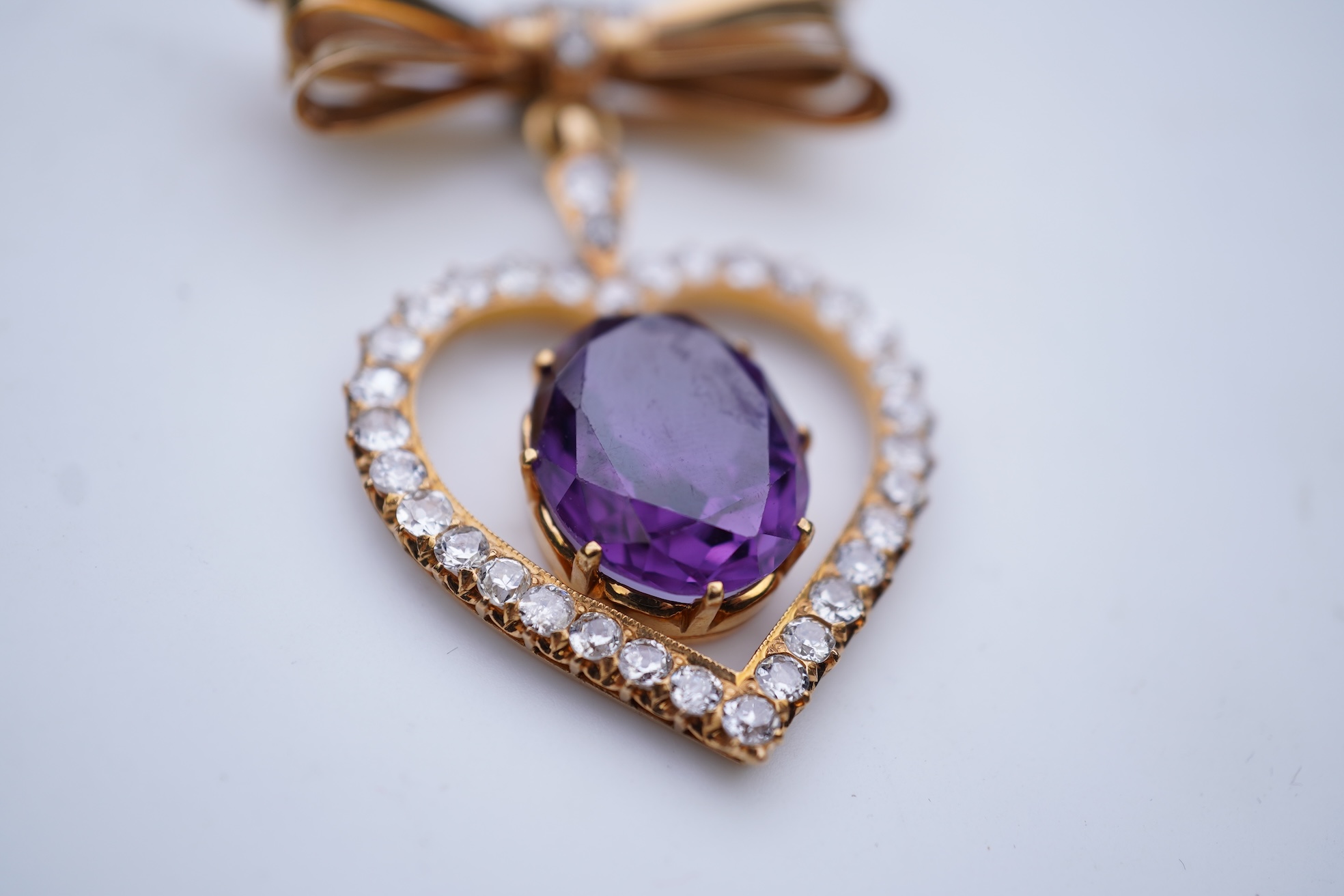 A synthetic sapphire and diamond pendant, mid 20th century